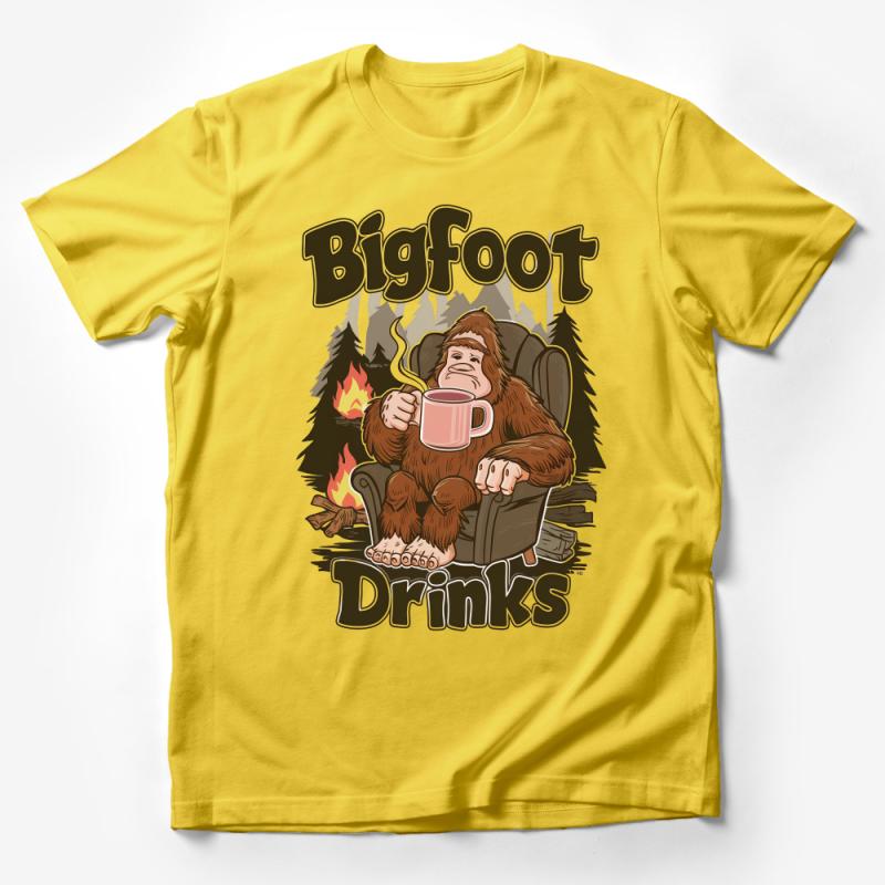 Bigfoot Drinks Graphic Tee, Cozy Sasquatch Relaxing with Coffee, Camping Enthusiast T-Shirt, Unique Forest Creature Shirt Design Male T-Shirt